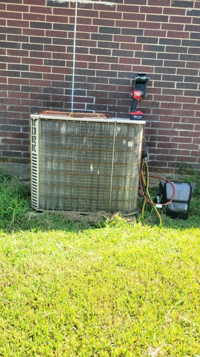 AC unit being serviced by 3M Refrigeration technician